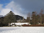 SX02573 Round Tower Glendalough in snow.jpg